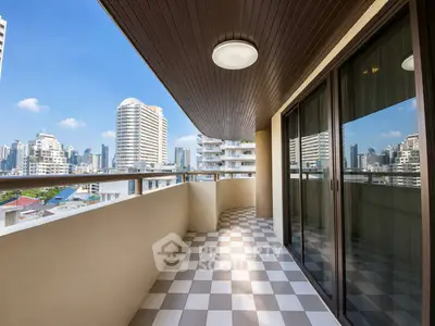 Spacious balcony with city skyline view, perfect for relaxation and entertainment.