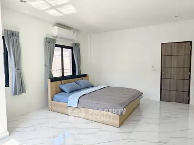 Spacious bedroom with modern design and natural light