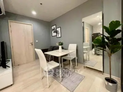 Modern living room with sleek dining area and stylish decor