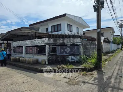 Charming corner unit house with unique exterior design and spacious layout.