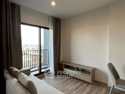 Modern living room with balcony view in urban apartment