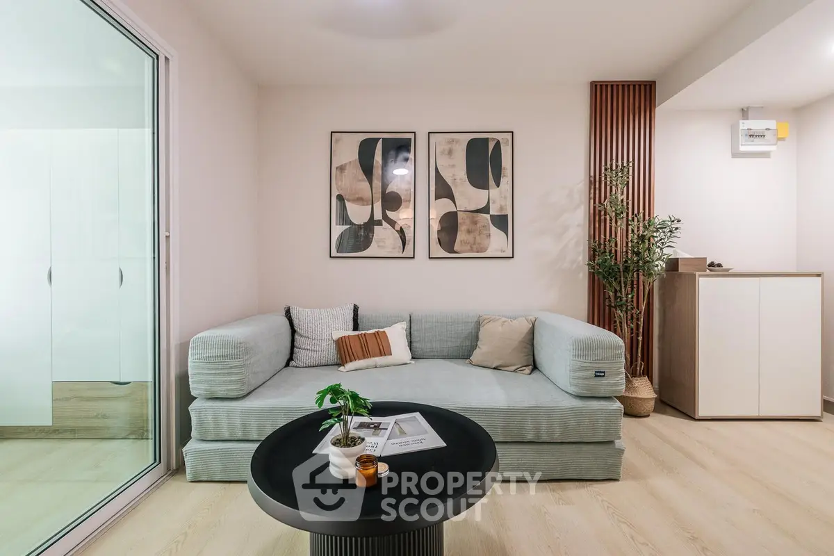 Modern living room with stylish decor and cozy seating area, perfect for relaxation and entertaining.
