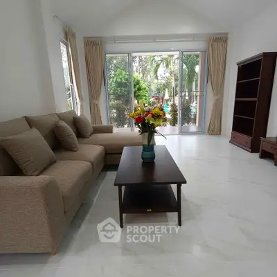 Spacious living room with garden view and elegant decor