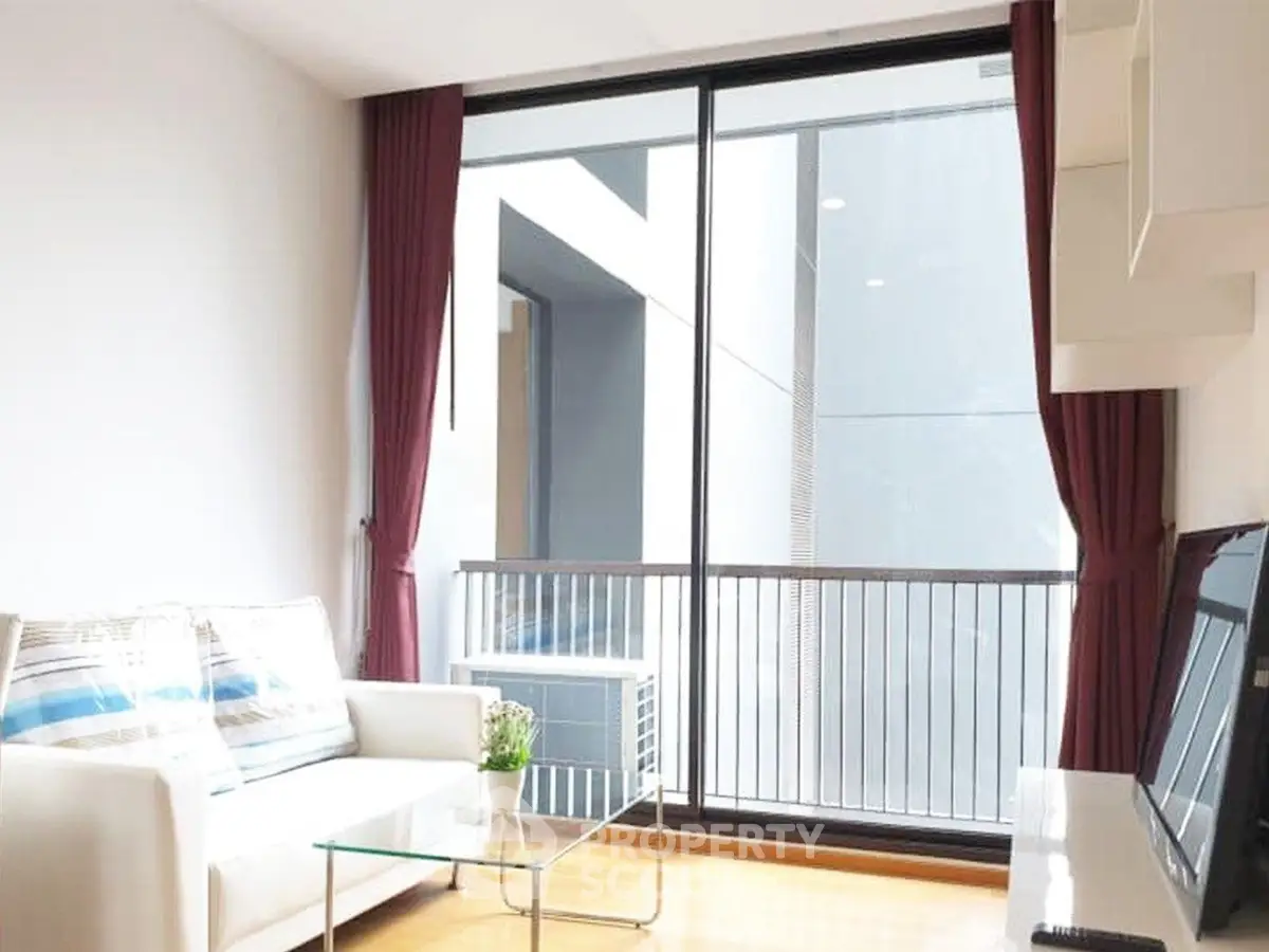 Modern living room with large glass doors and stylish decor