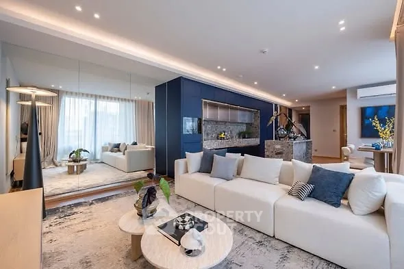 Luxurious modern living room with elegant decor and spacious seating area.
