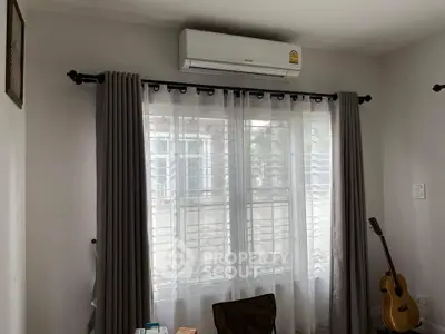 Cozy room with air conditioning and natural light through large window