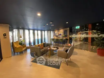 Modern living room with stylish furniture and large windows in a luxury apartment.