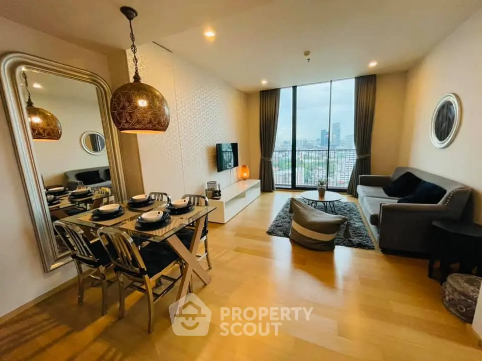 Modern living room with city view, stylish decor, and dining area in luxury apartment.