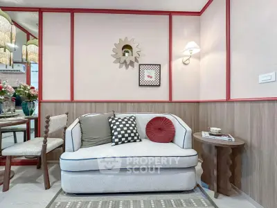 Charming living room with stylish decor and cozy seating in modern apartment.