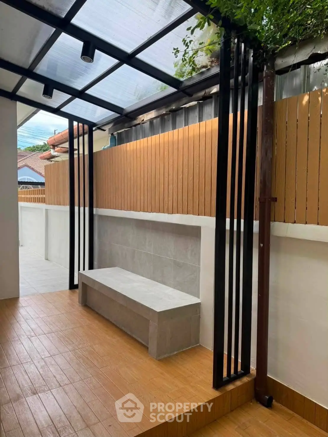 Modern outdoor patio with sleek design and wooden accents, perfect for relaxation and entertaining.