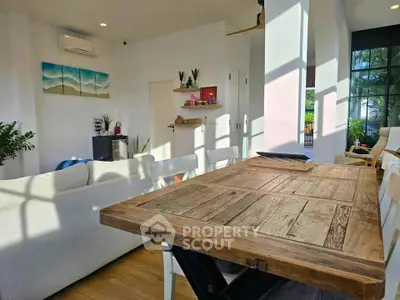 Bright and airy living room with rustic wooden table and modern decor