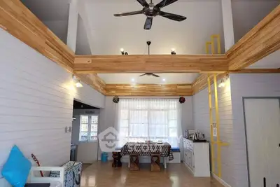 Spacious living room with high ceiling and modern decor
