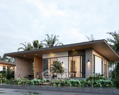 Modern single-story home with large windows and lush landscaping