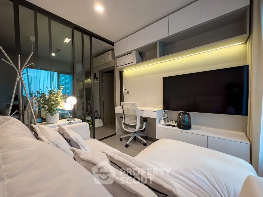 Modern living room with sleek design and integrated workspace