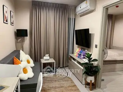 Cozy living room with modern decor and bedroom view, perfect for urban living.