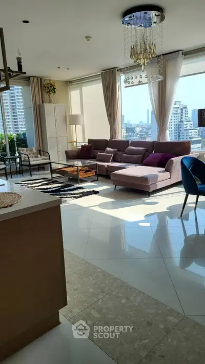 Luxurious living room with panoramic city views and elegant modern furnishings.