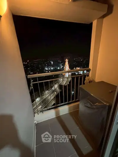 Stunning night city view from a cozy balcony, perfect for relaxation.