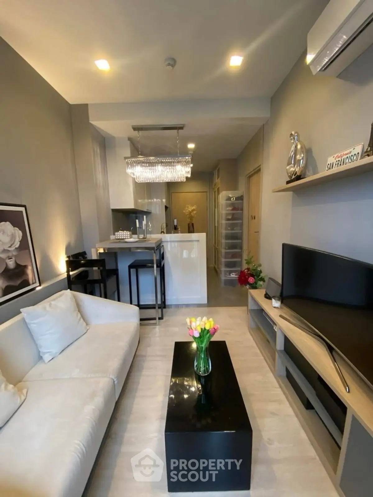 Modern living room with stylish decor and open kitchen layout