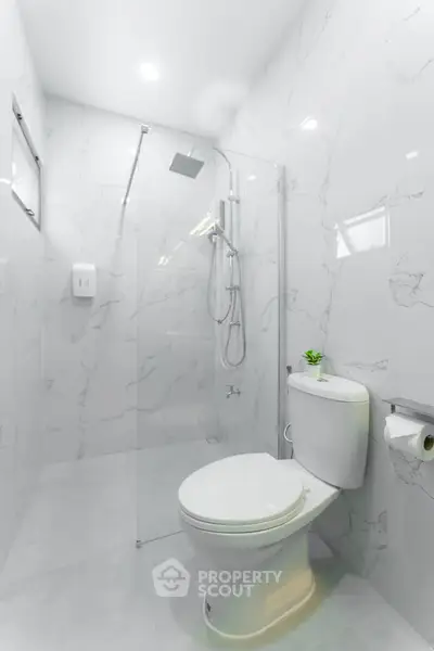 Modern bathroom with sleek design and glass shower enclosure