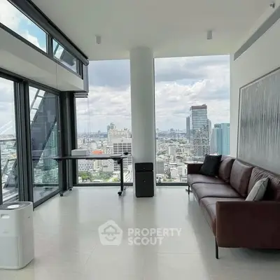 Luxurious living room with panoramic city views and modern furnishings.
