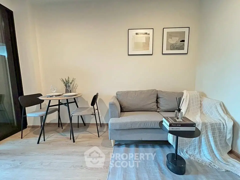 Cozy living room with modern decor and dining area, perfect for urban living.