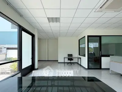 Spacious modern office space with glass walls and natural light