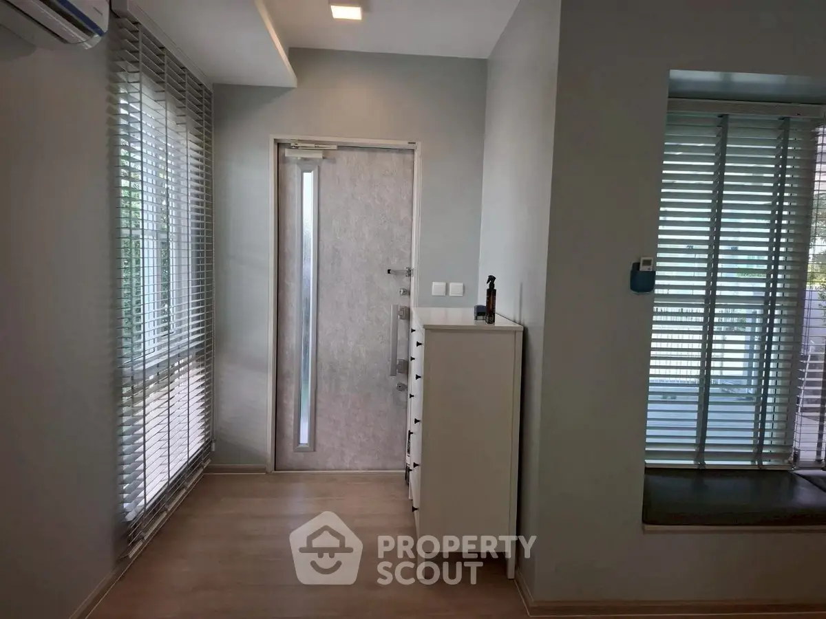 Modern interior hallway with sleek design and natural light