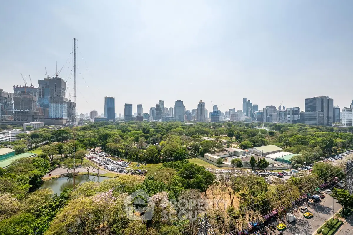 Stunning cityscape view with lush green park and skyline, perfect for urban living enthusiasts.