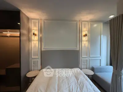 Modern bedroom with elegant lighting and cozy decor, featuring a plush bed and stylish side tables.