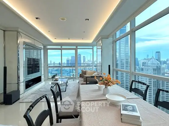 Luxurious high-rise living room with panoramic city views and elegant dining area.