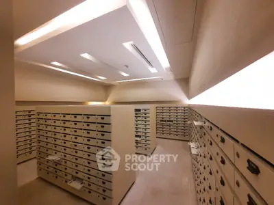 Spacious storage room with multiple secure lockers and modern lighting.