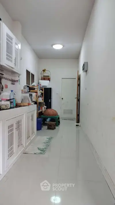 Spacious kitchen with closed layout and modern appliances