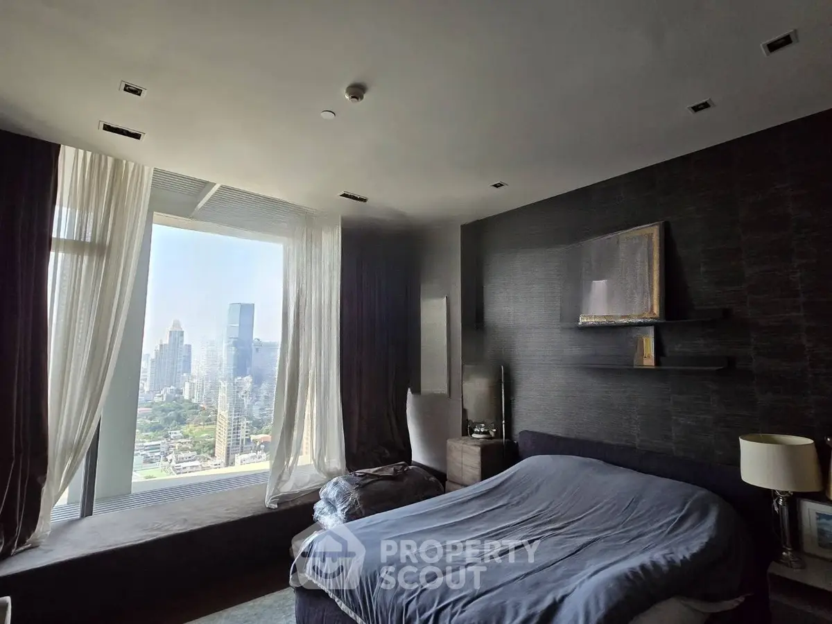 Luxurious bedroom with stunning city view and modern decor