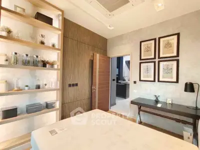 Modern bedroom with stylish decor and built-in shelving