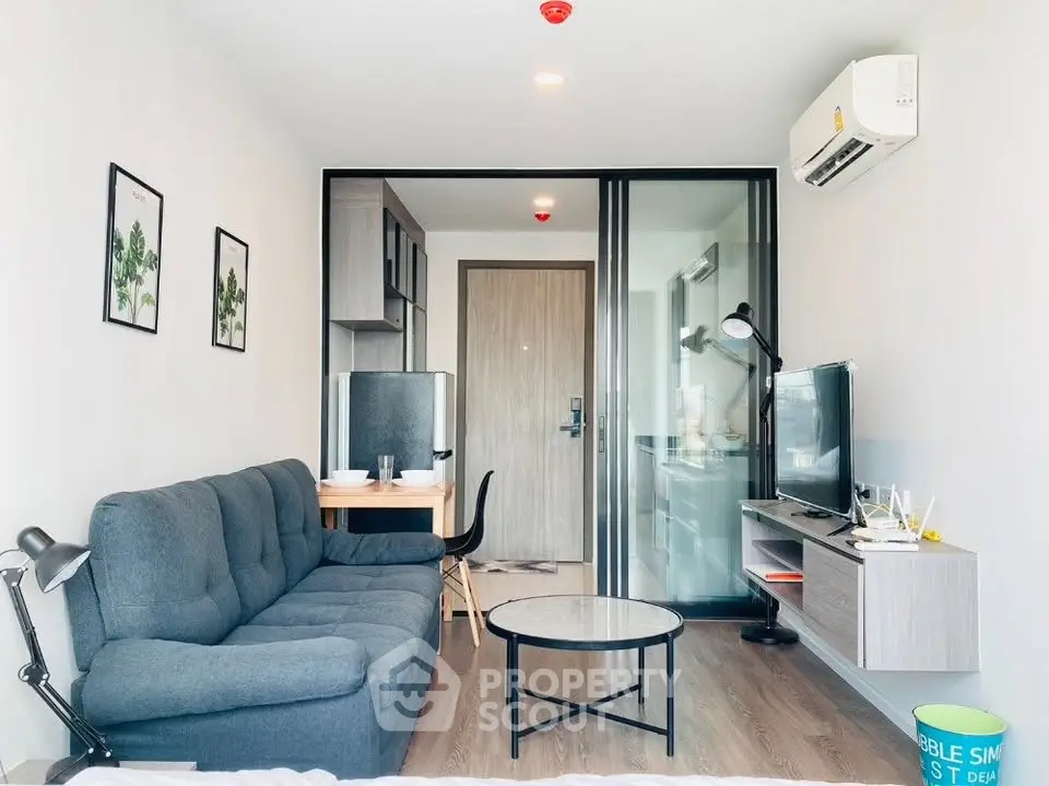 Modern living room with sleek furniture and stylish decor in a contemporary apartment.