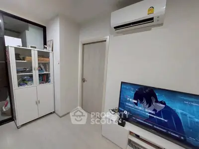 Modern living room with air conditioning and entertainment setup