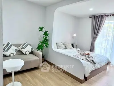 Modern studio apartment with cozy bed and stylish decor