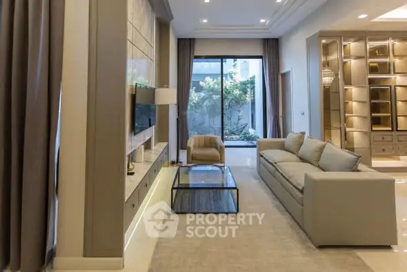 Luxurious living room with modern furniture and garden view