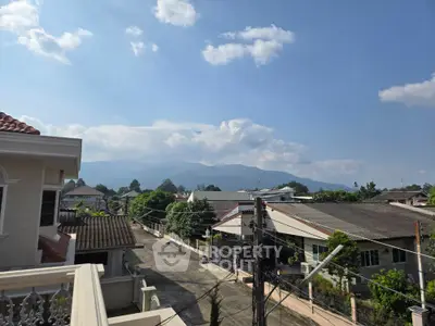 Scenic residential neighborhood with mountain views and clear blue sky