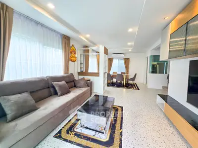 Modern living room with stylish decor and ample natural light