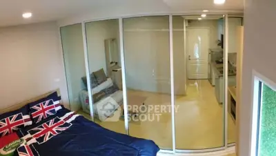 Modern bedroom with glass partition and stylish decor in urban apartment