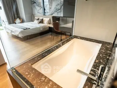 Luxurious bedroom with modern bathtub and elegant decor