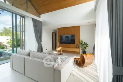 Luxurious modern living room with high ceilings and pool view