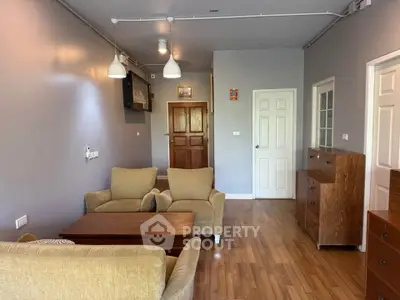 Cozy living room with modern furniture and wooden flooring