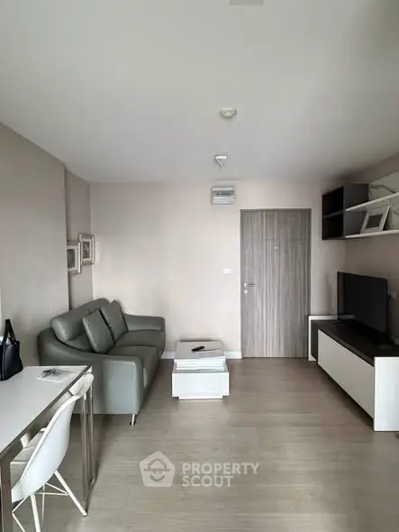 Modern living room with sleek furniture and neutral tones, perfect for urban living.