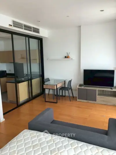 Modern living room with open layout and sleek furniture