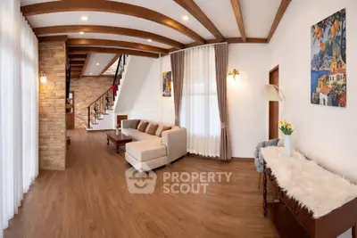 Spacious living room with modern decor and wooden flooring