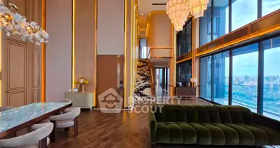 Luxurious high-rise living room with panoramic city views and elegant modern decor.