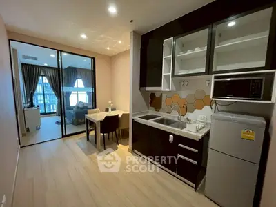 Modern open-layout kitchen with dining area and living room view