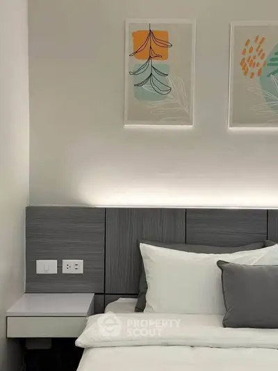 Modern bedroom with stylish decor and cozy bedding